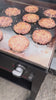5L burgers cooking on the trailer griddle